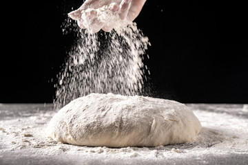 dough with flour on a black background