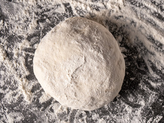 dough with flour on a black background