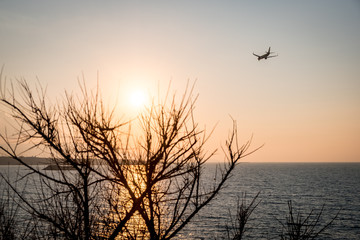 Airplane is landing during sunrise at Crete, Greece