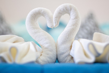 Obraz premium White towel, heart shape