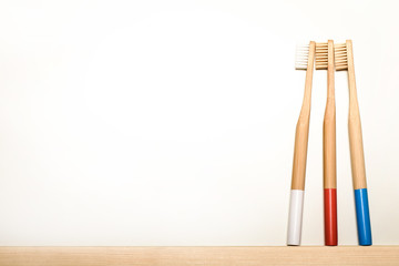 full colours bamboo toothbrushes on white background. Place for text. Ecoproduct.   eco-friendly.