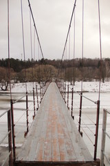 suspension bridge over the frozen river