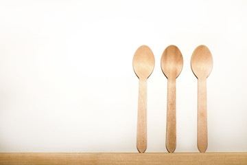 Disposable tableware from natural materials, wooden spoon,   eco-friendly. Place for text