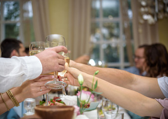 Celebration. People holding glasses of champagne making a toast