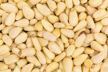 close-up background of raw pine nuts