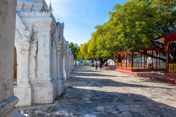 "The world biggest book" contained in white stupas inscribed on large stones at Kuthodaw Pagoda, Mandalay, Myanmar.
