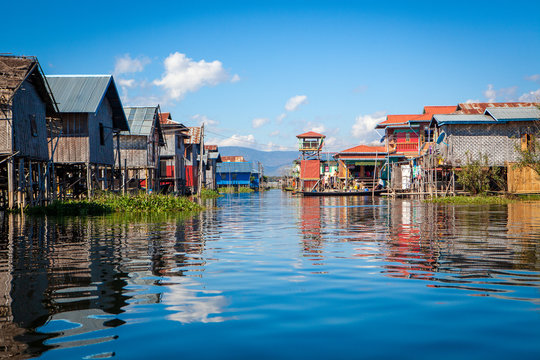 View to traditional floating village with houses built on piles at Inle lake, shan state, Myanmar.