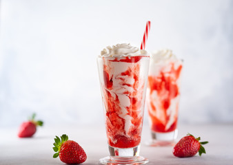 Strawberry milkshake with whipped cream.