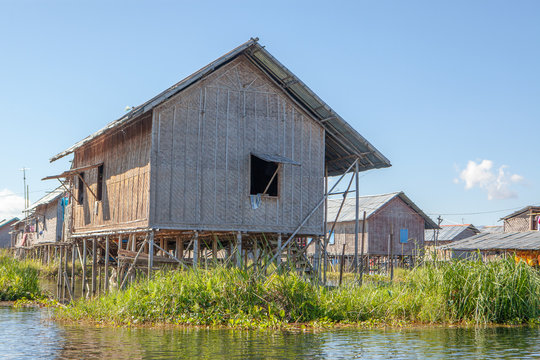 View to traditional floating village with houses built on piles at Inle lake, shan state, Myanmar.
