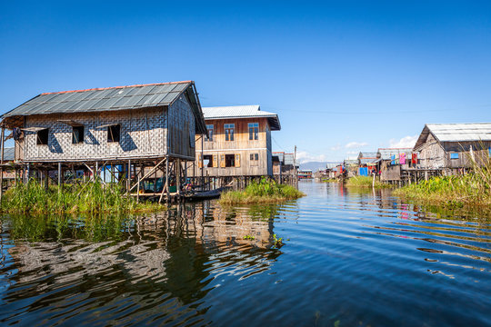 View to traditional floating village with houses built on piles at Inle lake, shan state, Myanmar.