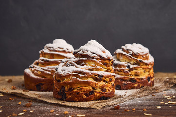 Tasty sweet buns with raisins and icing sugar. Homemade baking concept