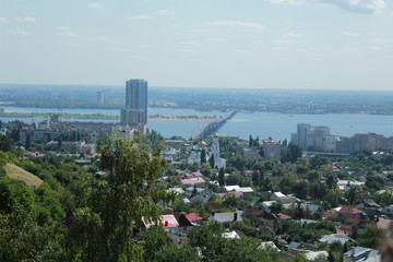 City panorama. Bridge over river at summer day