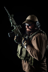 Armed soldier ready for battle. Military concept.