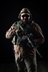 Naklejka premium Armed soldier ready for battle. Military concept.