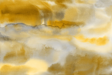 Yellow spring watercolor texture with abstract washes and brush strokes on the white paper background. Chaotic abstract organic design.
