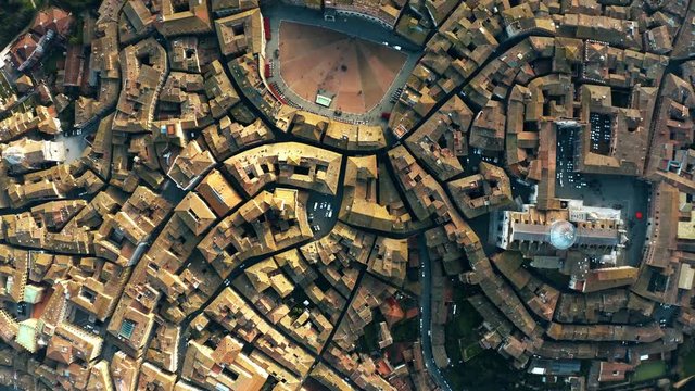 Aerial top-down view of Siena involving Piazza del Campo or Campo Square, a place of famous horse-race, Palio di Siena. Italy