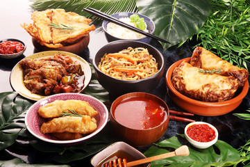 Assorted Chinese food set. Chinese noodles, fried rice, peking duck, dim sum, spring rolls. Famous Chinese cuisine dishes on table. Chinese restaurant