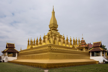 Fototapeta na wymiar The golden Pagoda at Wat Pha That Luang Temple in Vientiane, Laos
