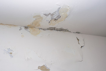Damage ceiling from water pipelines leakage. Housing problem concept