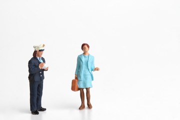 miniature of  a policewoman writing a ticket for a violation