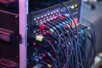 many cords inserted into the remote at the concert