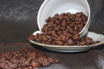 Coffee beans and scattered on the background. - Image