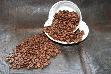 Coffee beans and scattered on the background. - Image