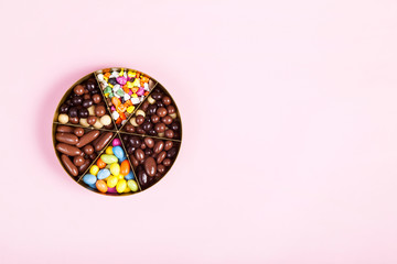 Colorful lollipops and different colored round candy. Top view.