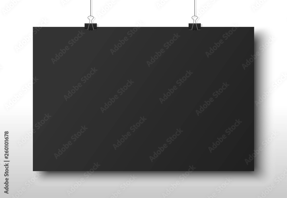 Poster blank dark paper hanging on two office clip. mock up template for your design. horizontal empty shee