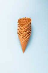 Line of Waffle cornet on light blue background.