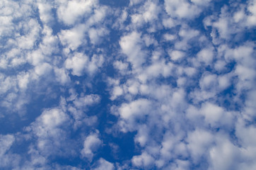blue sky with fluffy white clouds