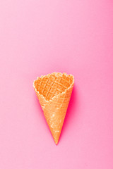 Sweet wafers cones isolated on pink background.