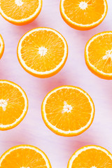 Background of oranges fruits. Many halves of fresh oranges, top view. Citrus for making juice. A lot of sliced oranges on a white background. Concept