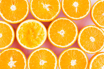 Background of oranges fruits. Many halves of fresh oranges, top view. Citrus for making juice. A lot of sliced oranges on a white background. Concept