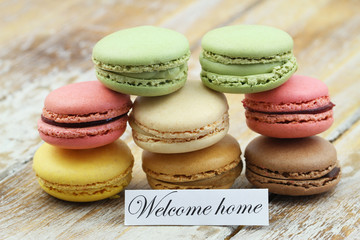 Welcome home card with stack of colorful macaroons