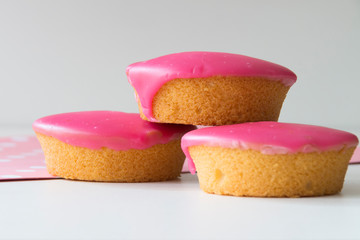 traditional Dutch cake with pink frosting, glazed, called Roze Koek.