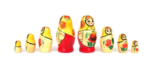 Traditional Russian wooden toy "Matryoshka" isolated on white background