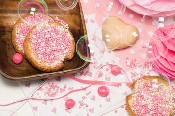 rusk with white and pink aniseed balls, Dutch Muisjes, traditional food in The Netherlands when a baby girl is born