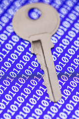 Key isolated on programm code background. Programming, safity, networs. Security concept