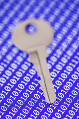 Key isolated on programm code background. Programming, safity, networs.