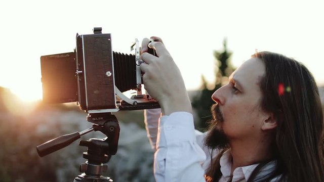 Photographer customizes large format camera before shooting