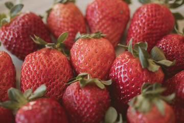 Fresh strawberry background. Close up view of red ripe strawberries.  