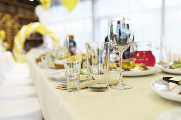 Glasses on the table in the restaurant. Table setting.