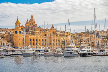 Birgu waterfront marina with sailing boats in front of the Maritime Museum and St. Lawrence Church, Dockyard Creek, Birgu, Malta