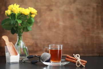 A cup with tea on the table