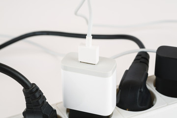 Overloaded power boards on a white background