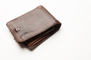 Empty old leather wallet isolated on white