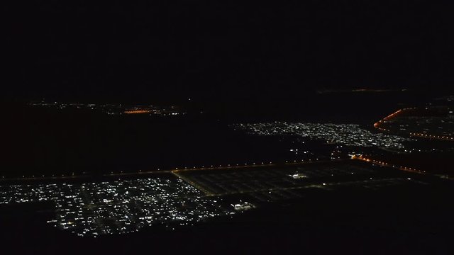 A Panorama of Al Ain, United Arab Emirates View at Night from Jebal Hafeet (Jebel Hafit) showing the city lights from the top of the mountain.