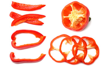 cut slices of red sweet bell pepper isolated on white background top view