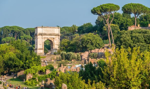 Titus Arch in the roman forum on a sunny summer day. Rome, Italy.